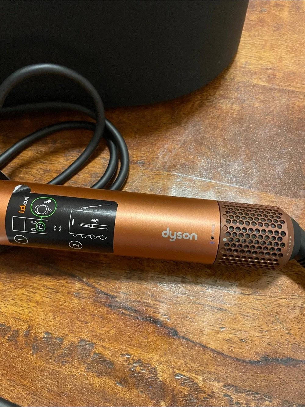 Dyson Airwrap i.d. Straight+wavy. Color copper and black.